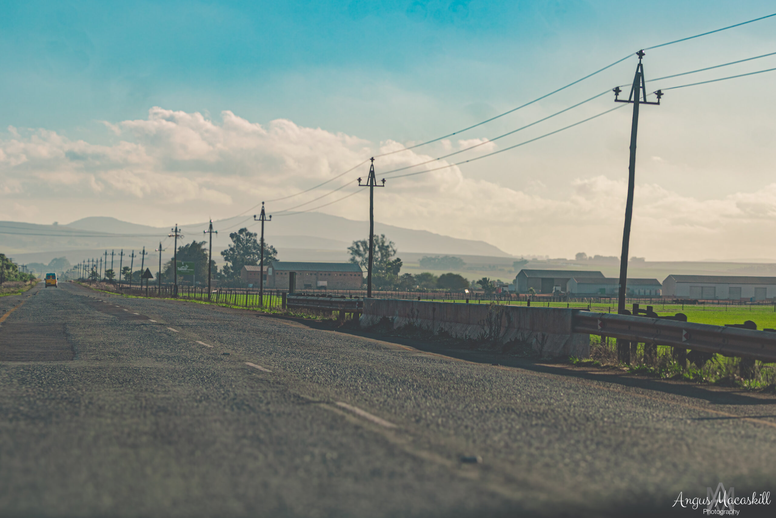Rural road and mountain landscape photographed by Angus Macaskill