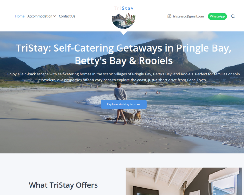 TriStay accommodation website homepage, showing coastal hero and navigation